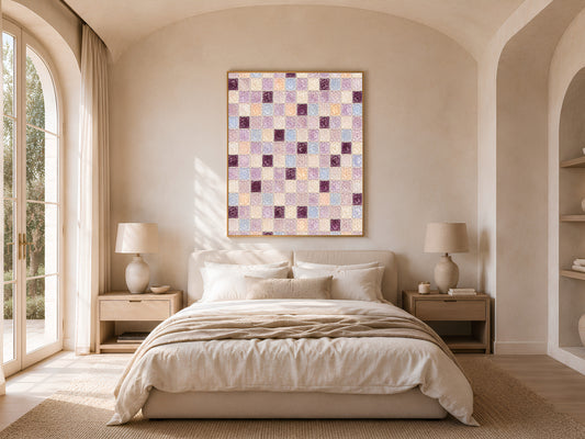 Plum lavender mosaic wall art framed above a bed in a warm arched-window bedroom