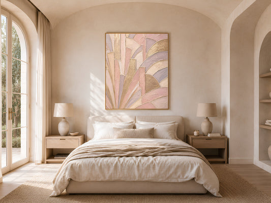 Art deco sunburst print framed above bed in warm neutral bedroom, blush pink and gold wall art