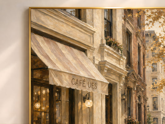 Close-up detail of framed autumn cafe oil painting print showing striped awning and Café UES sign