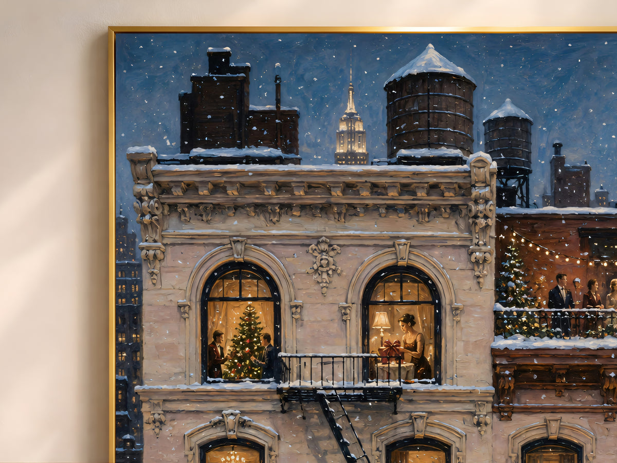Framed painting of snowy NYC brownstone with lit windows and water towers