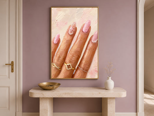 Framed manicure wall art print on a console table in a mauve entryway