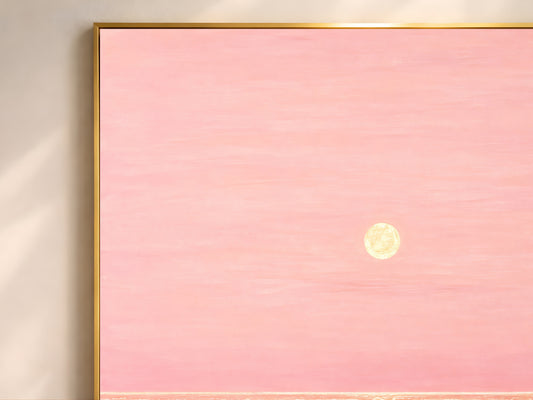 Close-up of pink and gold impasto ocean sunset painting texture in thin gold frame