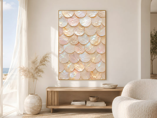 Iridescent capiz shell print in gold frame in bright neutral living room with cream armchair and pampas grass