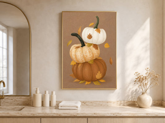 Stacked pumpkin wall art with autumn leaves in a sunlit farmhouse kitchen