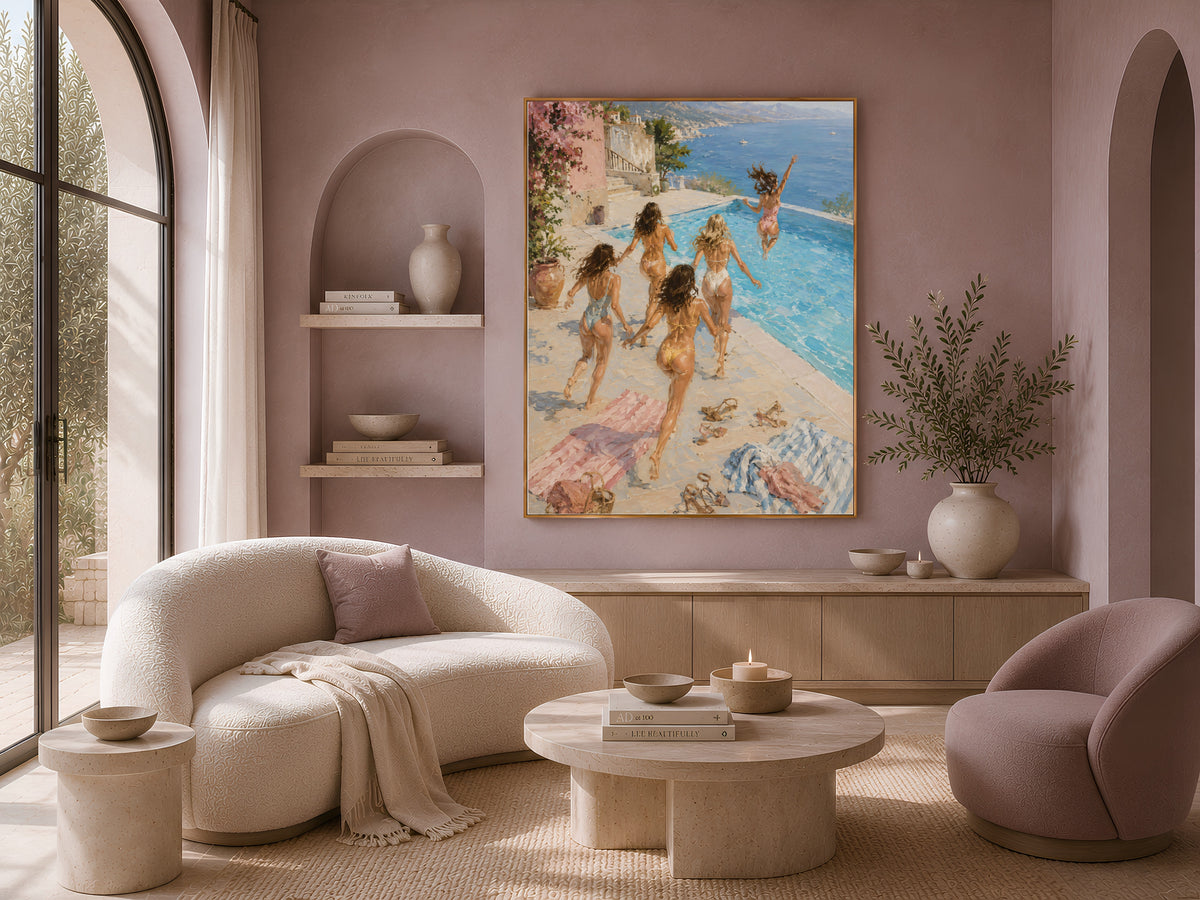 Girls trip pool print framed on a wall beside a cream sofa in a sunlit living room