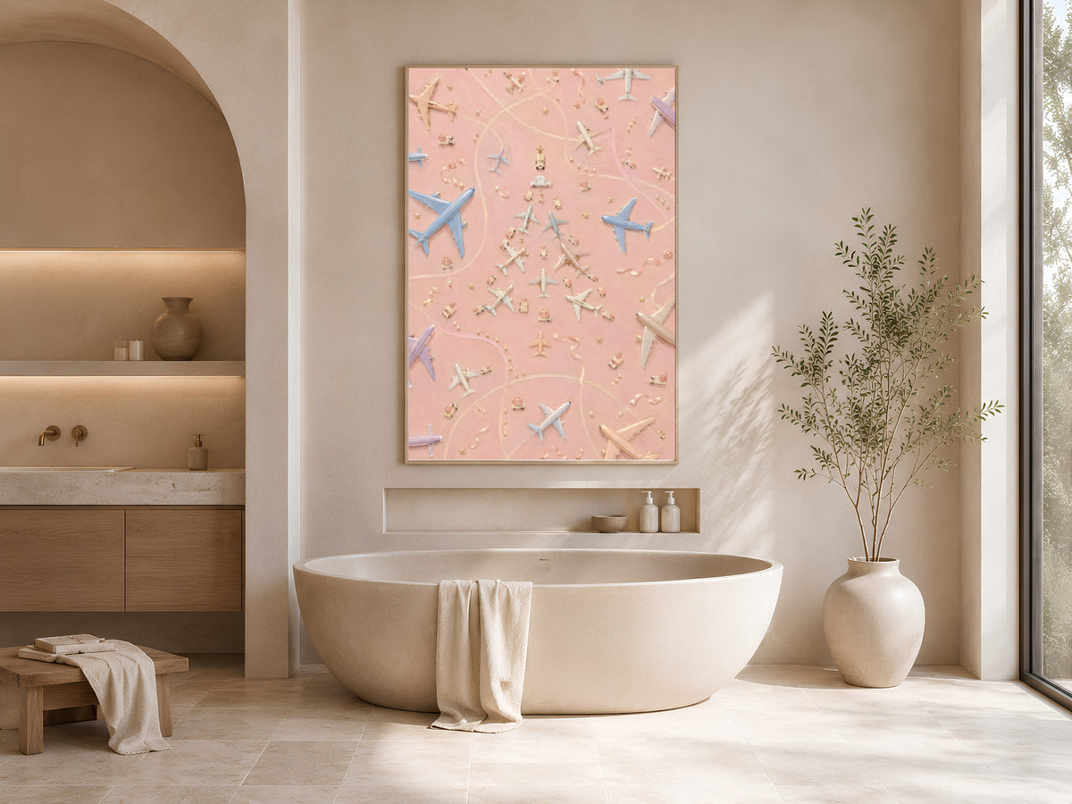 Airplane Christmas tree print framed above a freestanding tub in a sunlit arched bathroom