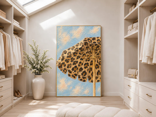 Framed leopard print beach umbrella impasto print in a light-filled walk-in wardrobe with white shelving, tall ceilings and natural light