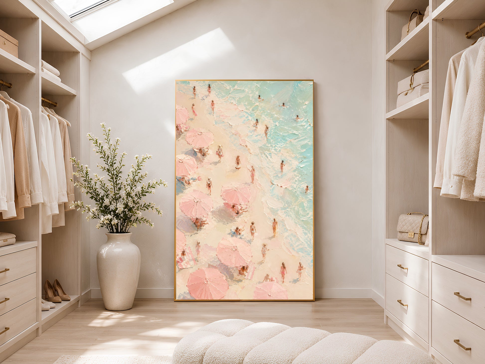 Pink beach figures wall art in gold frame displayed in a bright neutral walk-in wardrobe with open shelving and skylight