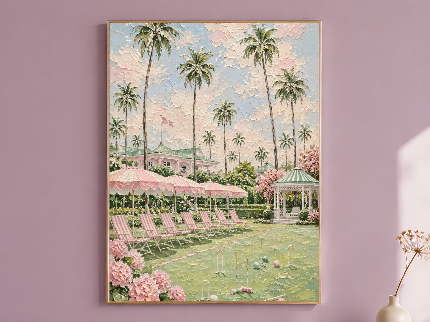 Pink preppy resort palm tree painting in a thin gold frame on a dusty lilac wall
