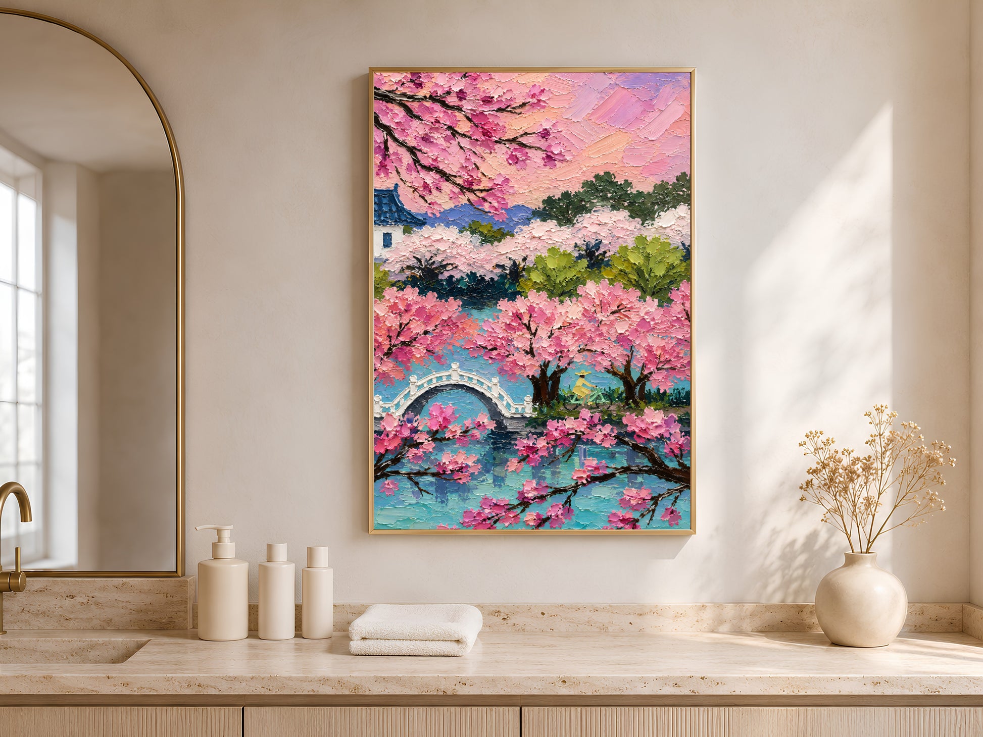 Cherry blossom sakura landscape print in gold frame in bright entryway with arched niche and neutral vases
