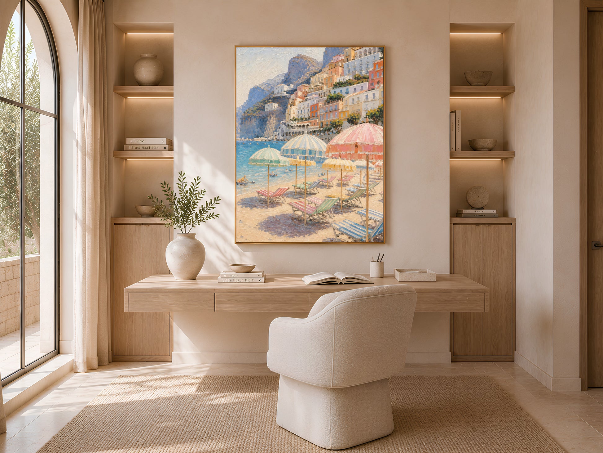 Framed Amalfi coast print above a desk in a neutral arched home office