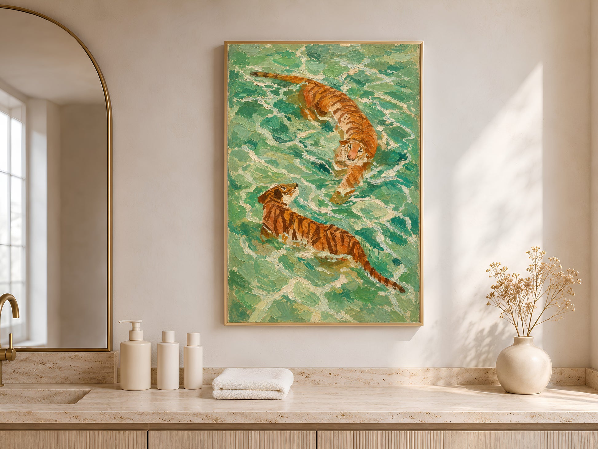 Framed aerial tiger wall art on a warm oak sideboard with white folded towels, a ceramic vase, and soft natural light from a nearby window
