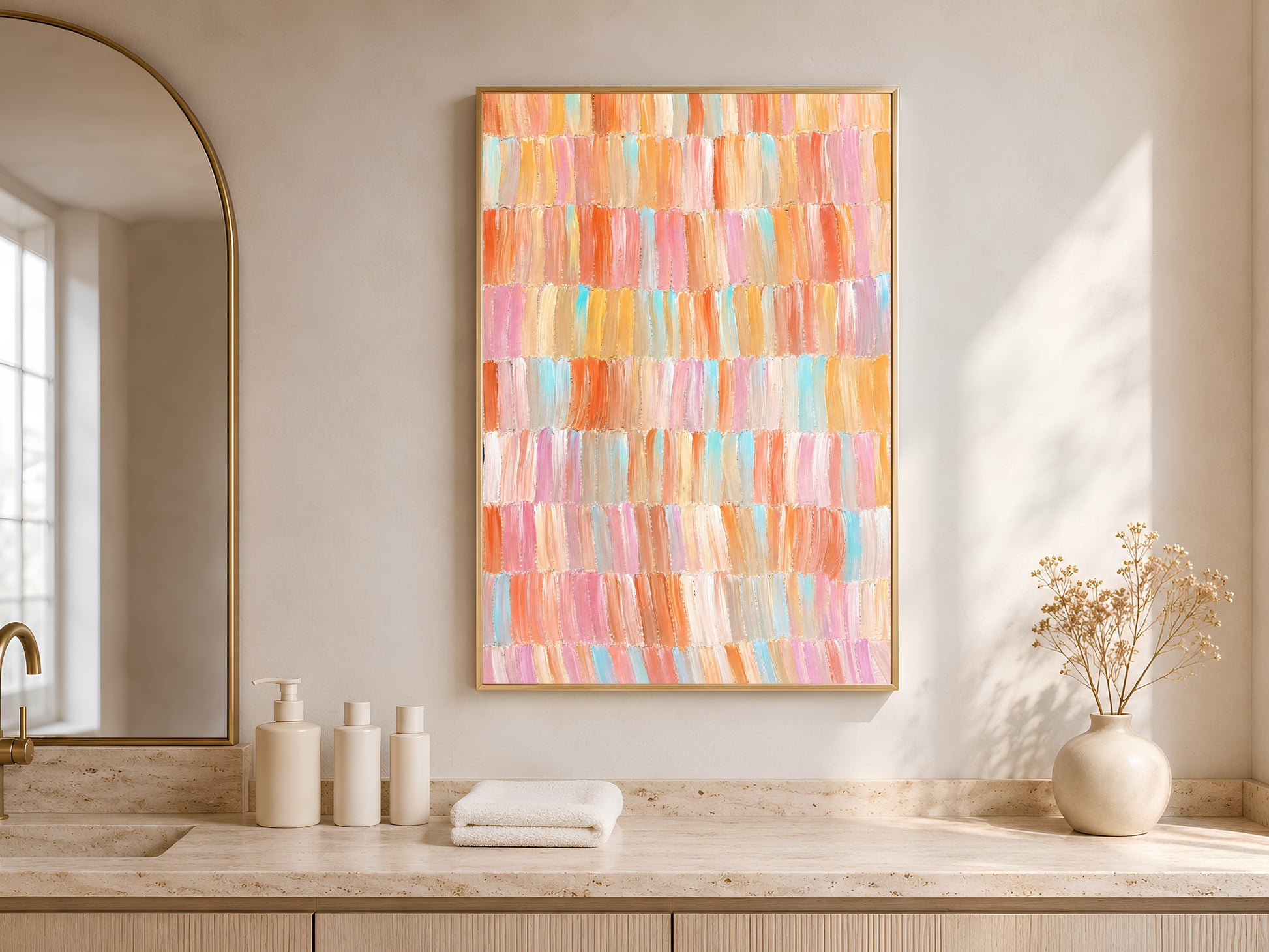 Framed colorful pastel brushstroke abstract art hanging in a bright minimal living room with arched window and white vases