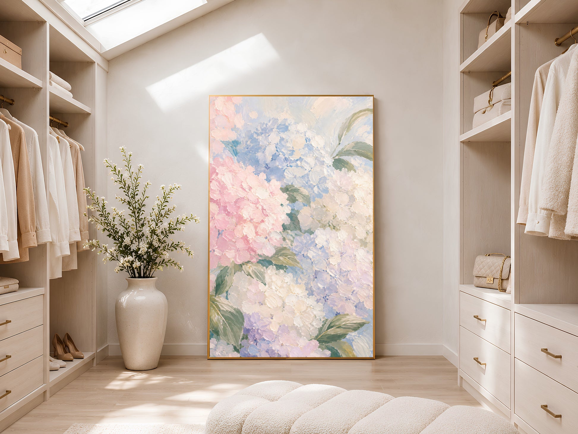 Pastel hydrangea floral art print in gold frame displayed in a bright neutral walk-in wardrobe with open shelving