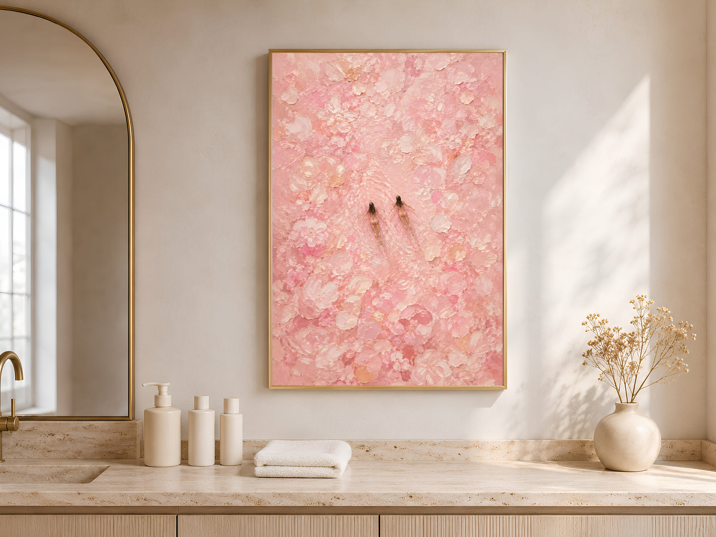 Framed pink swimmers wall art styled on a light oak sideboard with white ceramic vases and soft neutral decor beside a bright window
