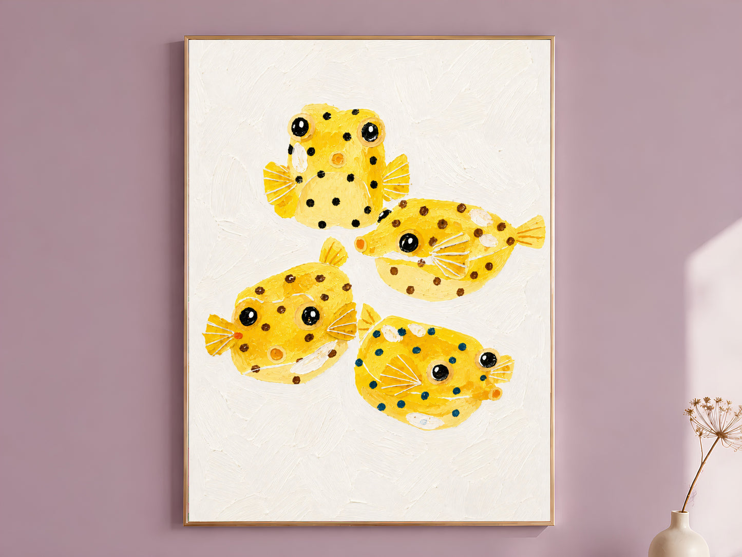 Yellow boxfish painting in a thin gold frame on a dusty lilac wall
