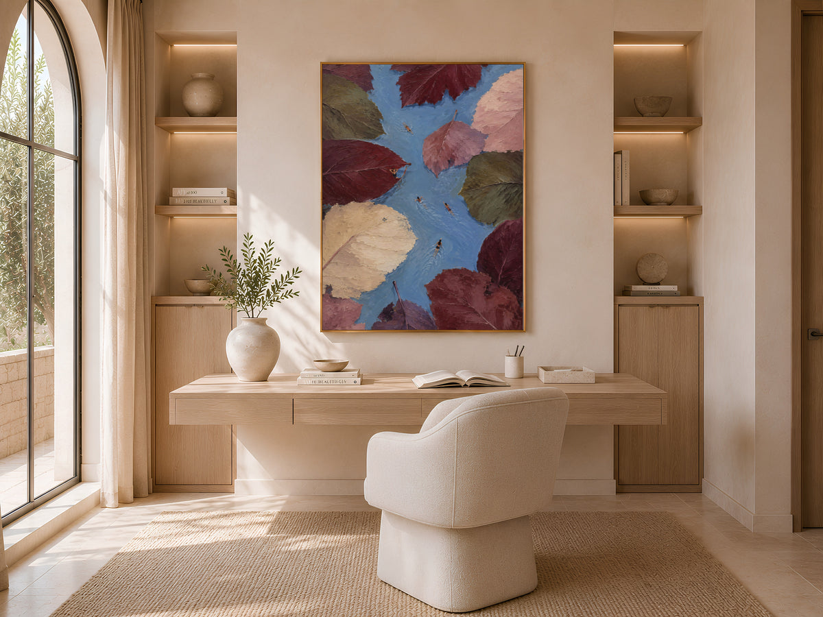 Surreal autumn leaves swimmer painting framed above desk in cozy neutral home office