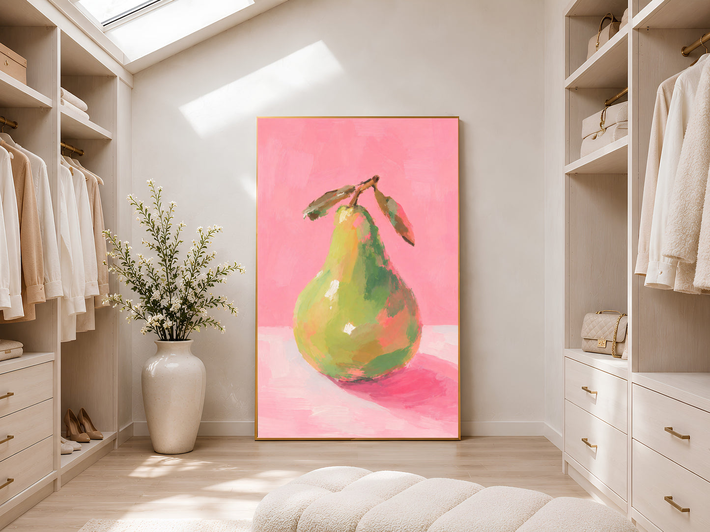 Large framed impasto green pear print leaning against white wardrobe wall in bright sunlit dressing room with tall vase
