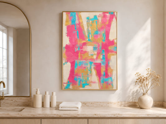 Framed hot pink teal and gold abstract art print displayed in a serene neutral bathroom with freestanding tub and arched alcove
