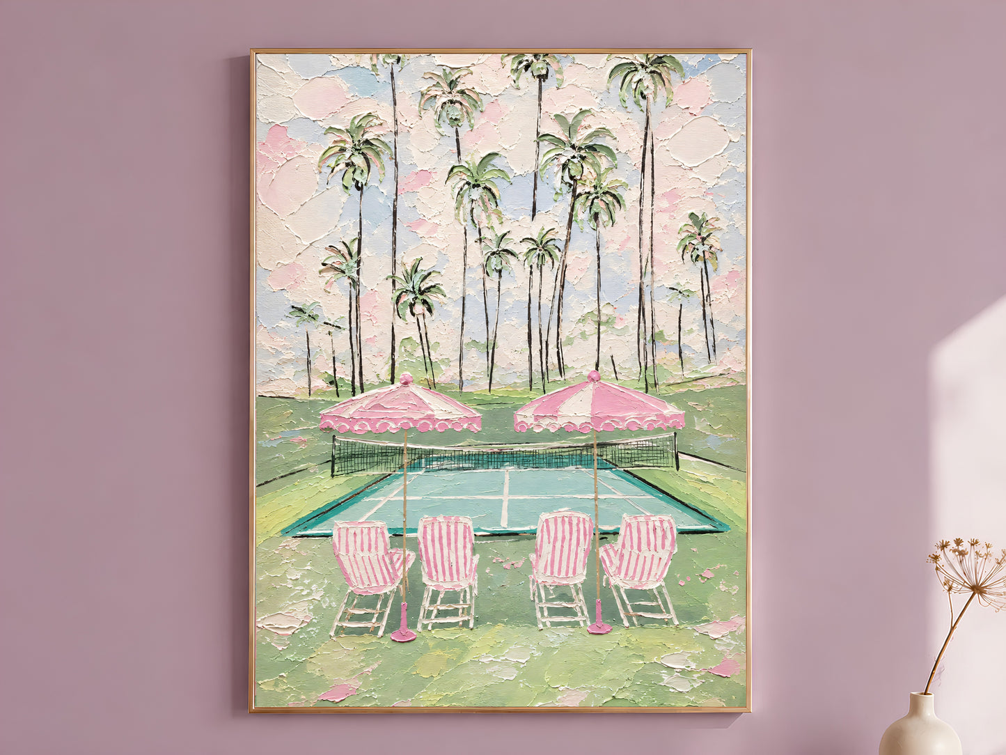 Pink tennis court impasto wall art in gold frame on mauve wall with dried flower stems beside it
