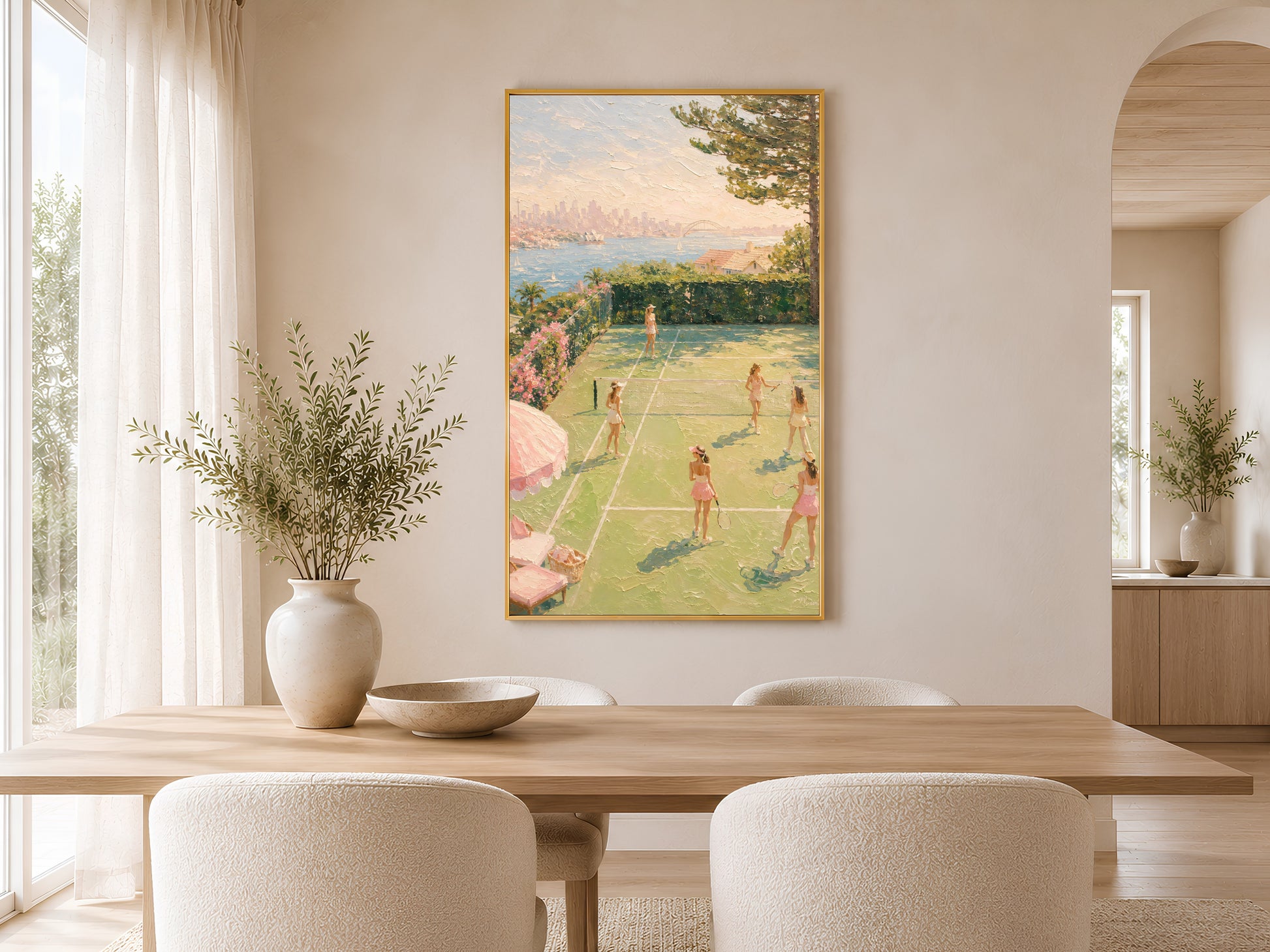 Preppy tennis court wall art in gold frame styled above a round dining table in a warm neutral dining room