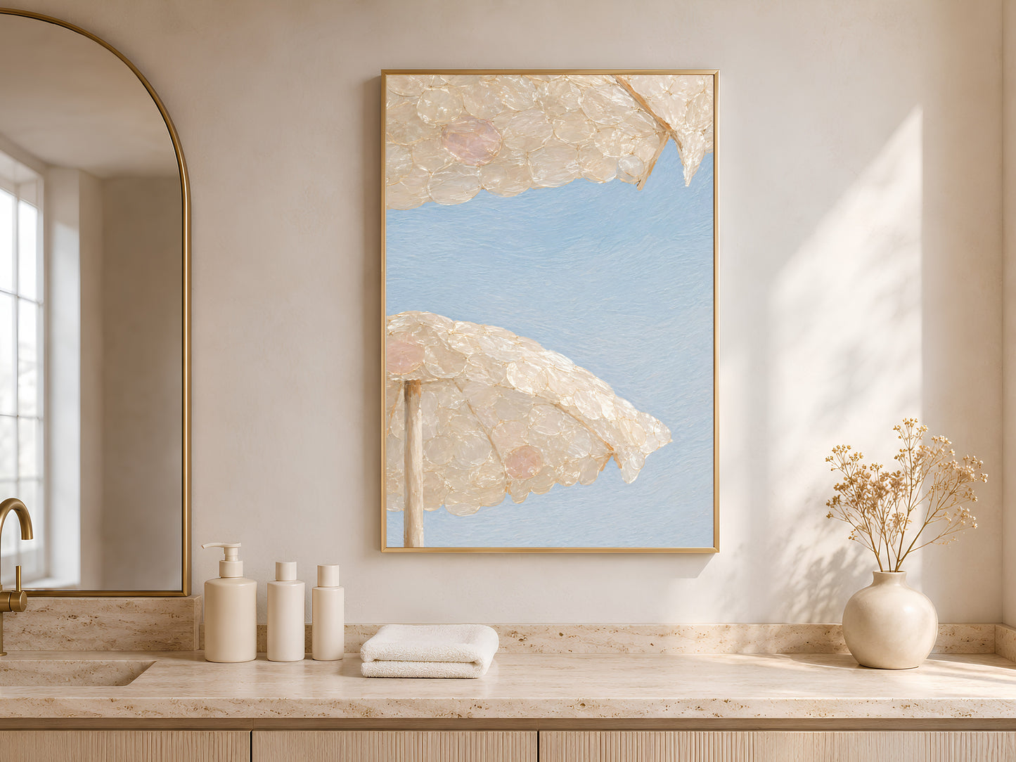 Capiz shell beach umbrella art framed above a bathroom counter with natural light
