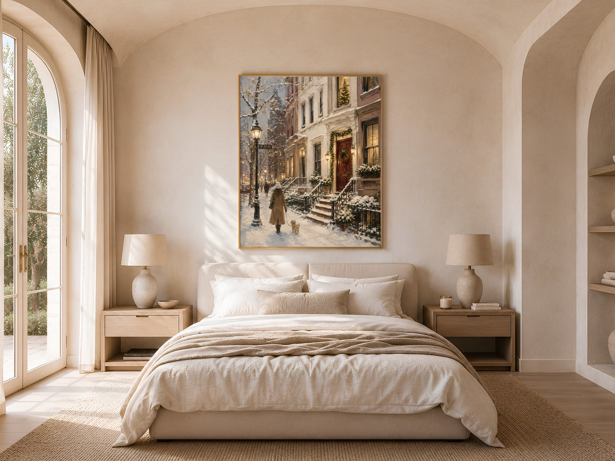 Snowy brownstone wall art framed print in bright bedroom with round pouf and neutral bedding