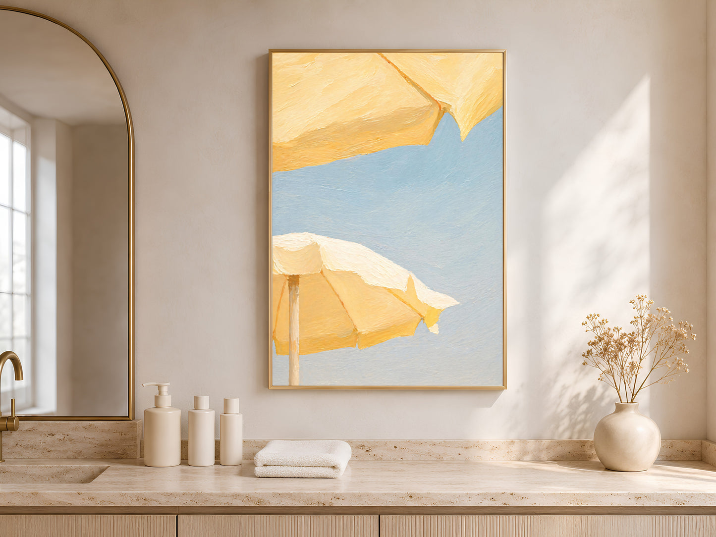 Butter yellow beach umbrella print framed above a bathroom counter with natural light
