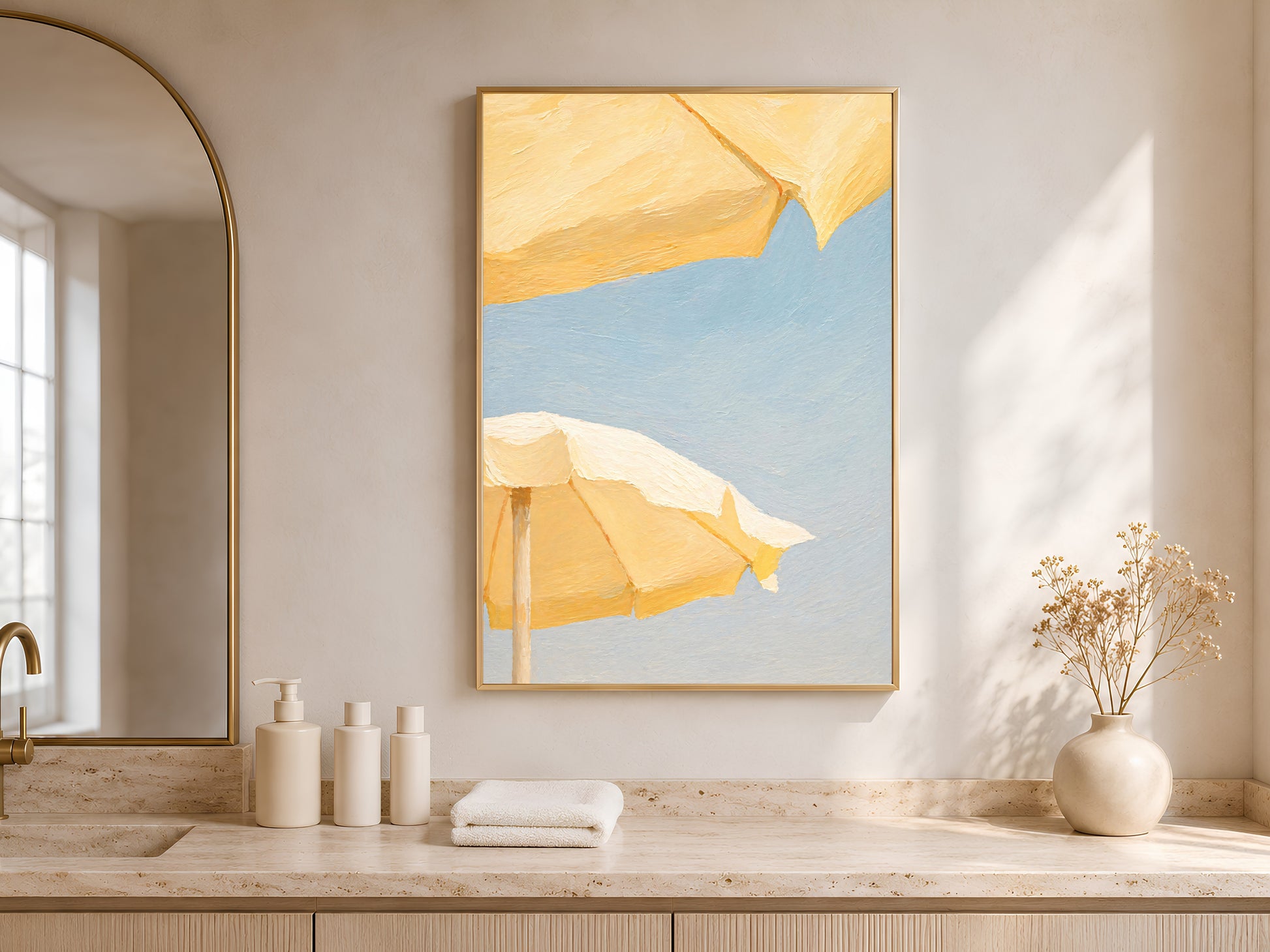 Butter yellow beach umbrella print framed above a bathroom counter with natural light
