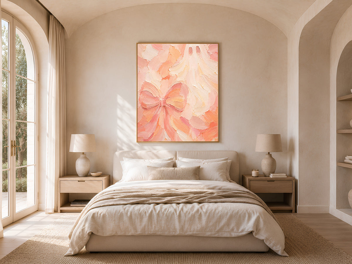 Pastel Halloween ghost bow wall art print framed above a bed in a warm neutral bedroom