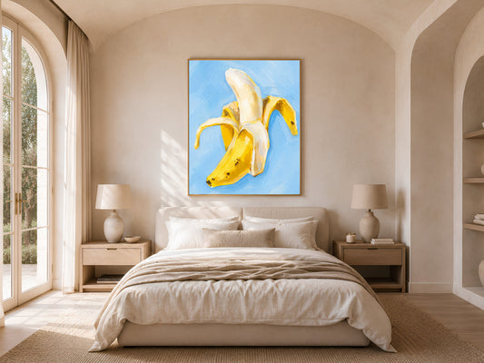 Framed banana still life art above bedside table in neutral bedroom, light blue kitchen wall art print