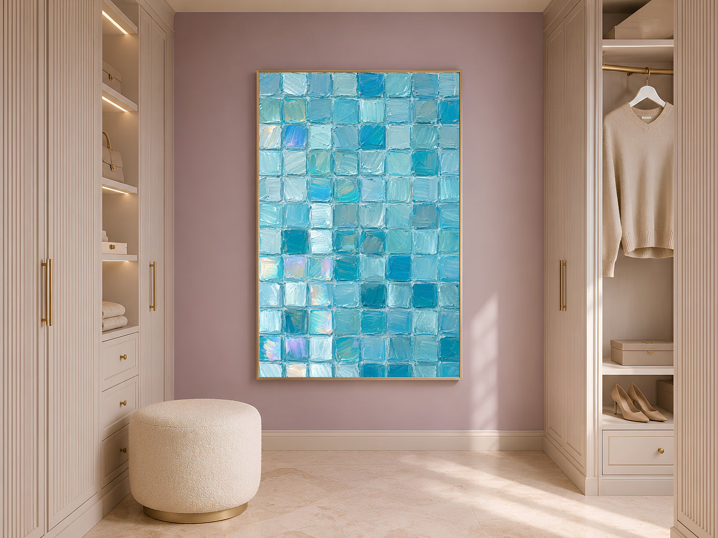 Turquoise aqua mosaic tile wall art in gold frame in styled dressing room with wardrobe and cream ottoman
