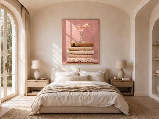 Martini still life print in gold frame above bed, vintage books oil painting in neutral bedroom decor
