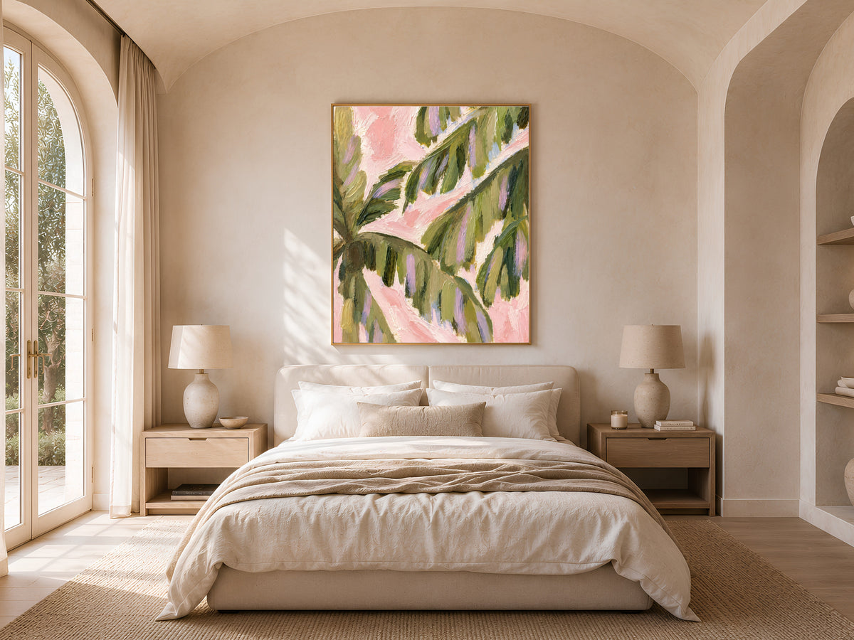 Preppy palm leaf wall art above a neutral bedroom bed