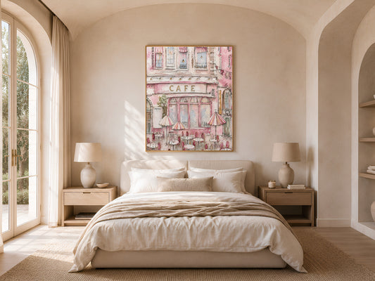 Parisian pink cafe painting framed in gold above a neutral bedroom bed, textured impasto artwork with arched window light
