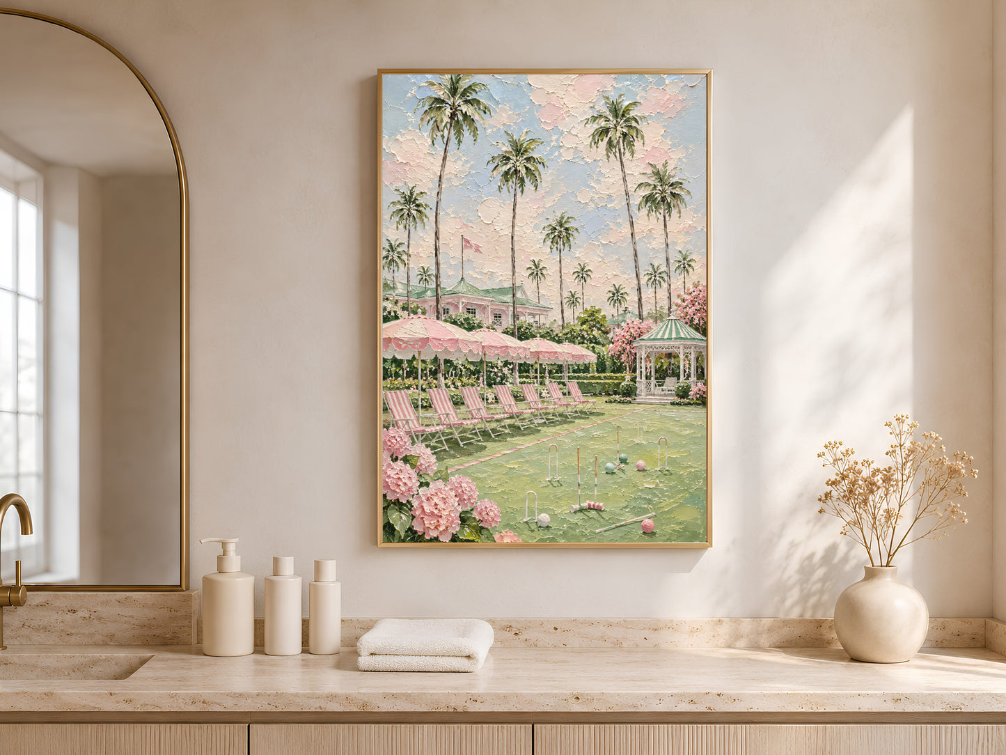 Pink preppy resort painting framed in an arched nook above a bathroom counter

