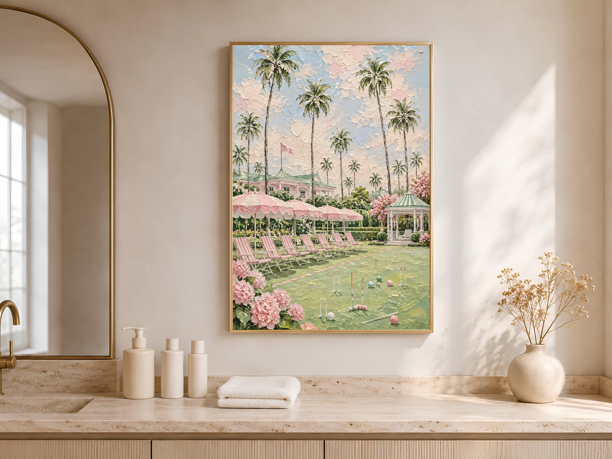 Pink preppy resort painting framed in an arched nook above a bathroom counter
