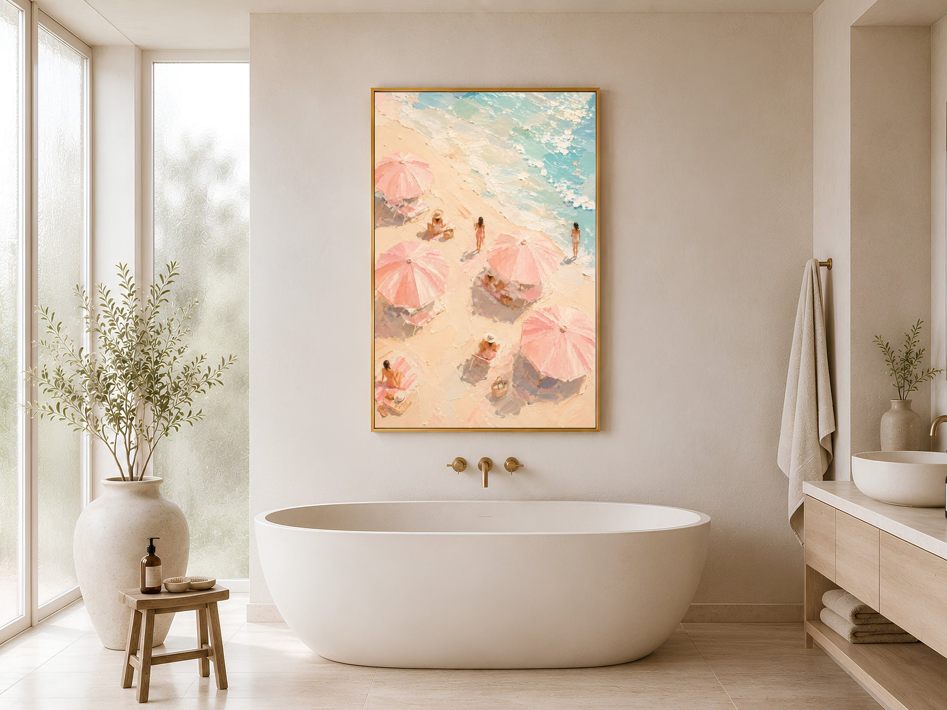 Pink coastal beach print in gold frame hung in a minimal white bathroom with freestanding bathtub and wood stool