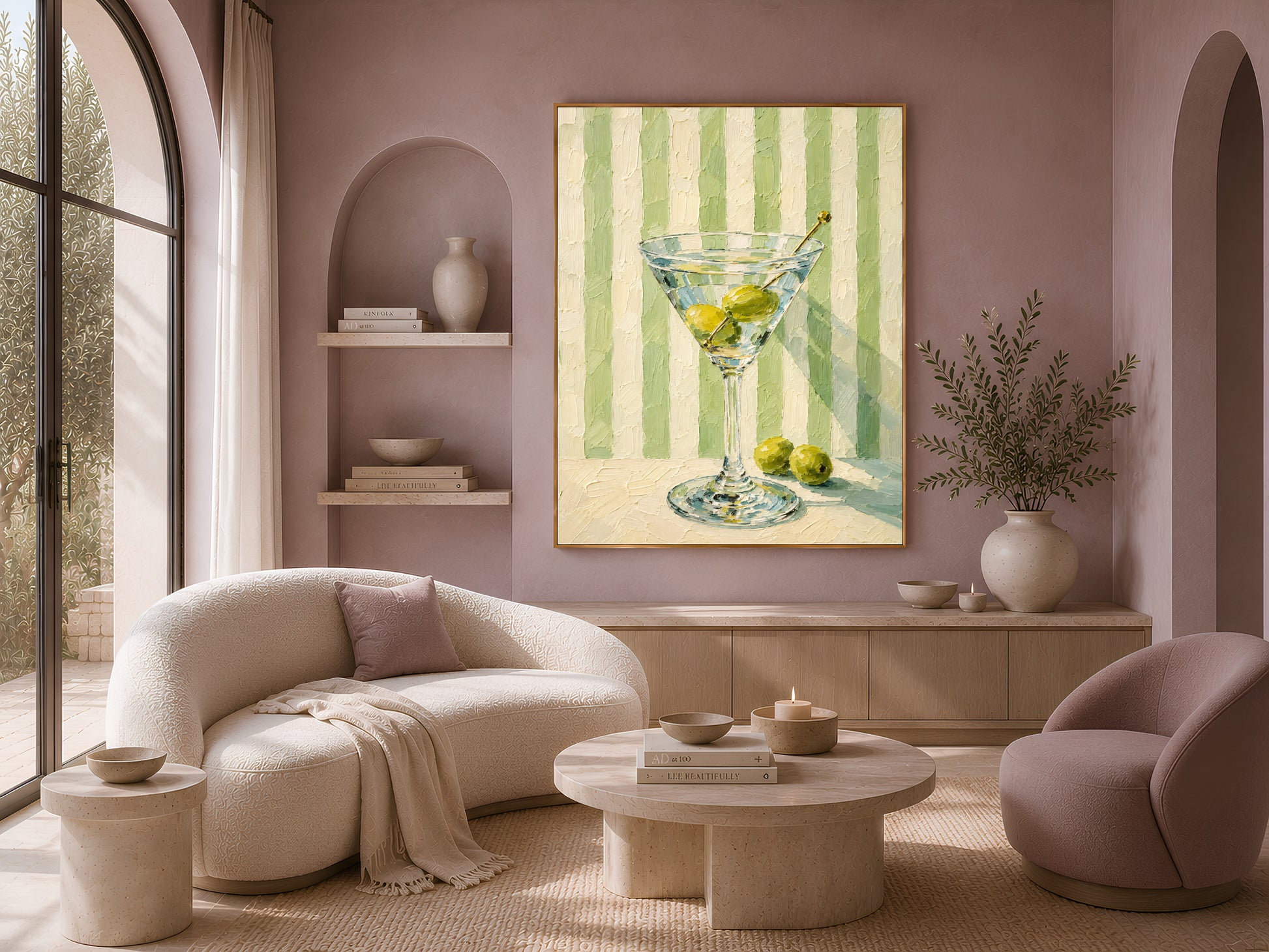 Martini glass print in gold frame above a cream sofa in a soft neutral living room