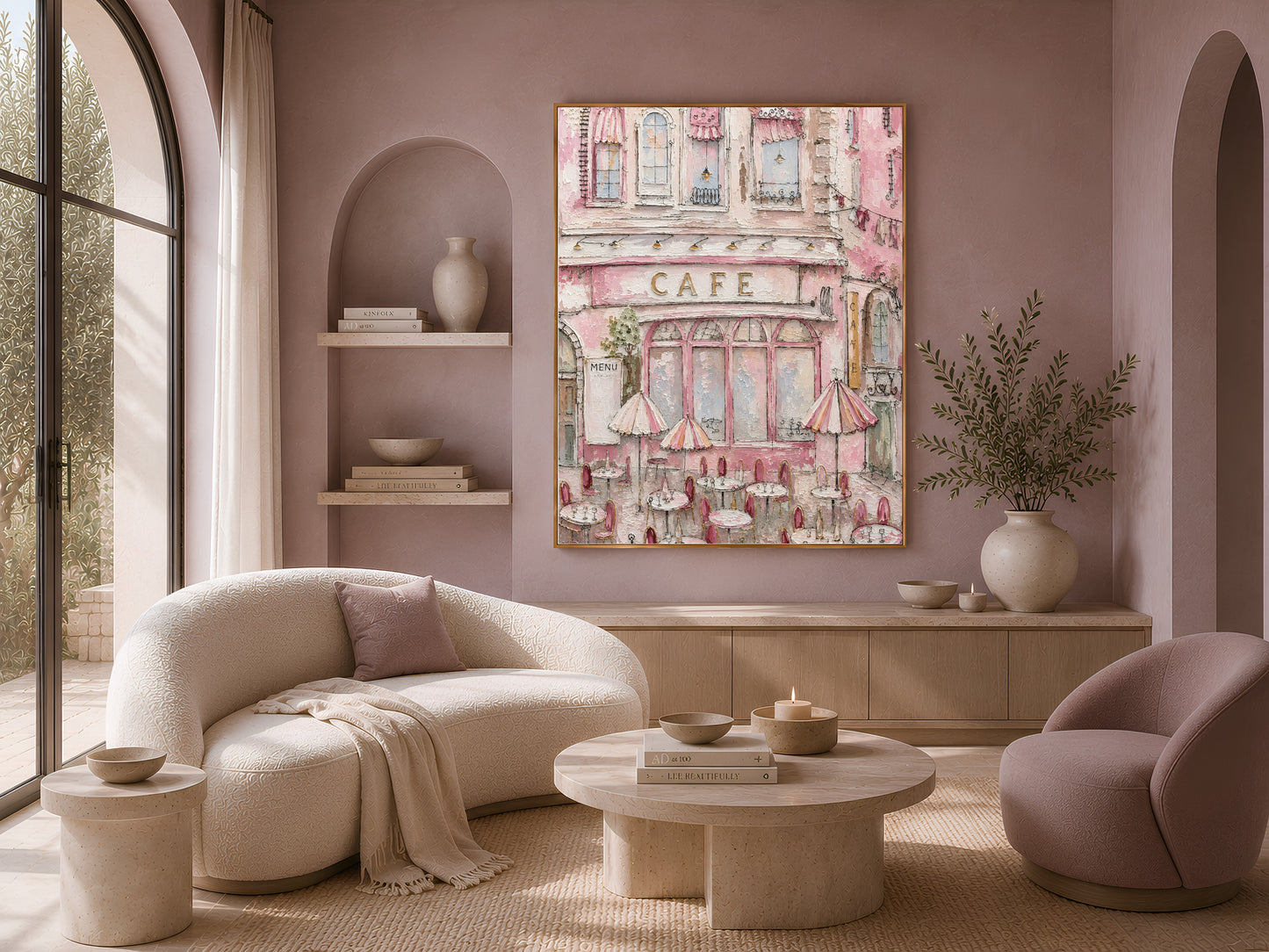 Textured Parisian cafe painting in a gold frame above a living room with a curved boucle sofa and armchair
