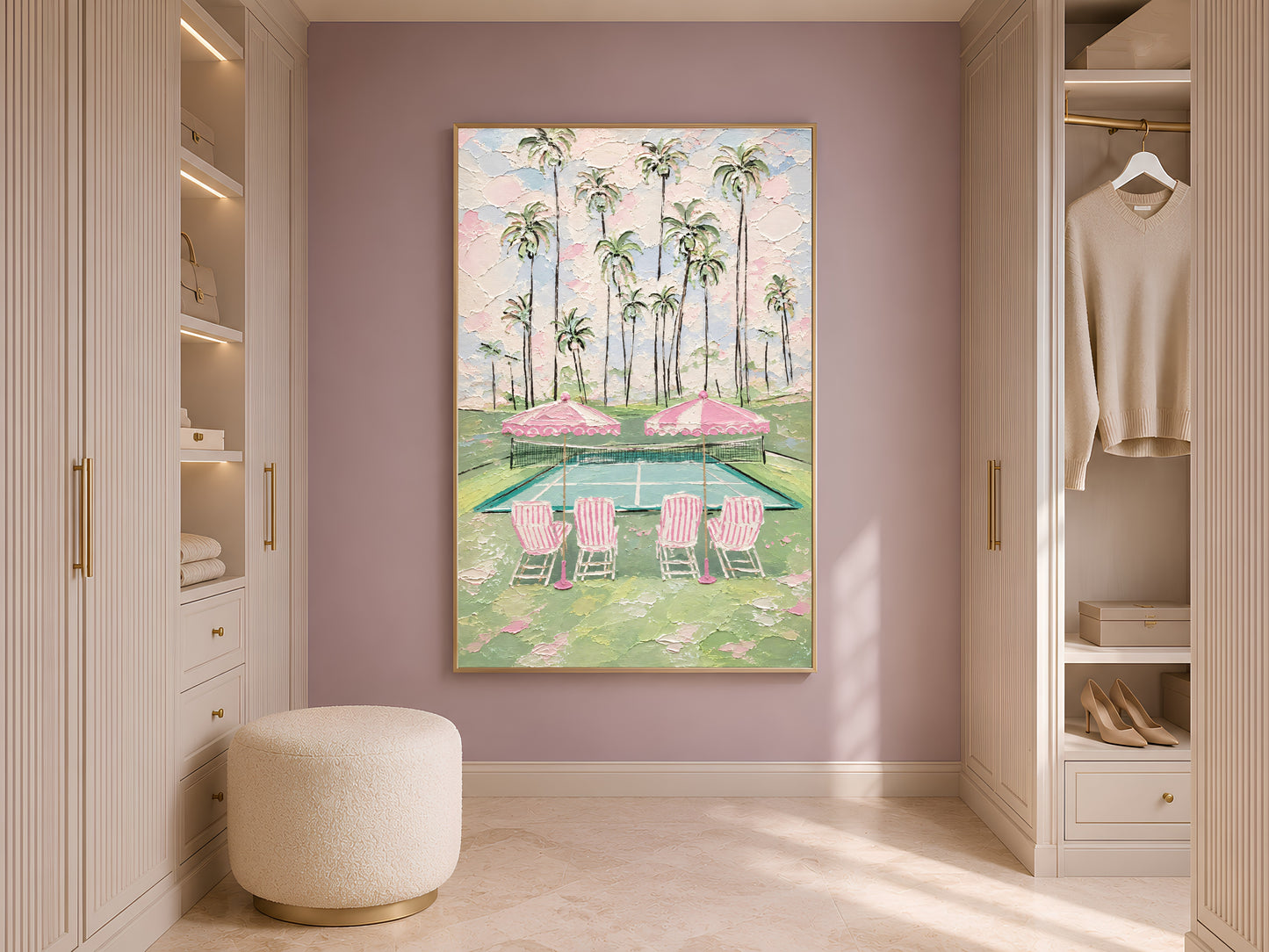 Pink tennis court wall art leaning against wardrobe in styled dressing room with arched doorway
