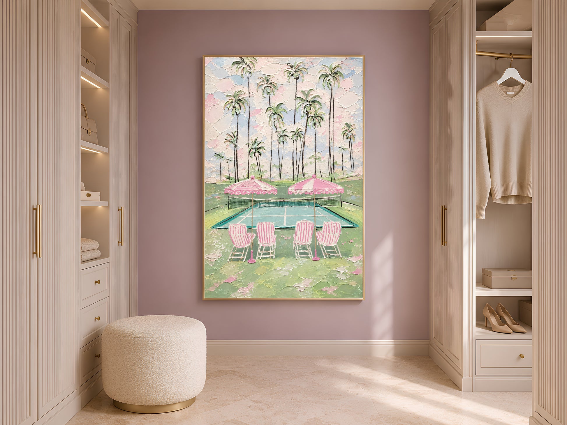 Pink tennis court wall art leaning against wardrobe in styled dressing room with arched doorway
