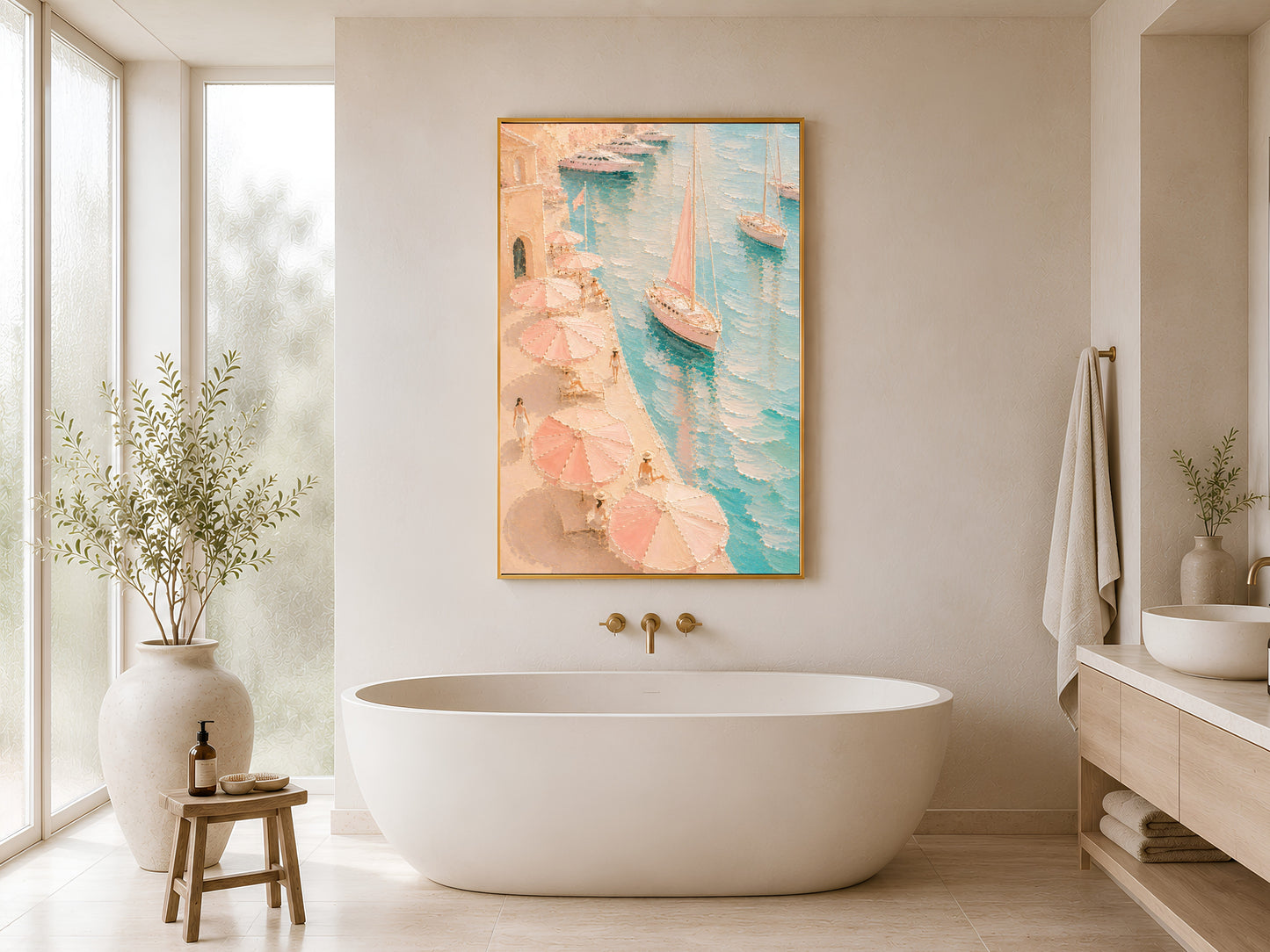 Framed Mediterranean harbor wall art in blush pink and teal on a warm white bathroom wall beside a freestanding bathtub and wood stool
