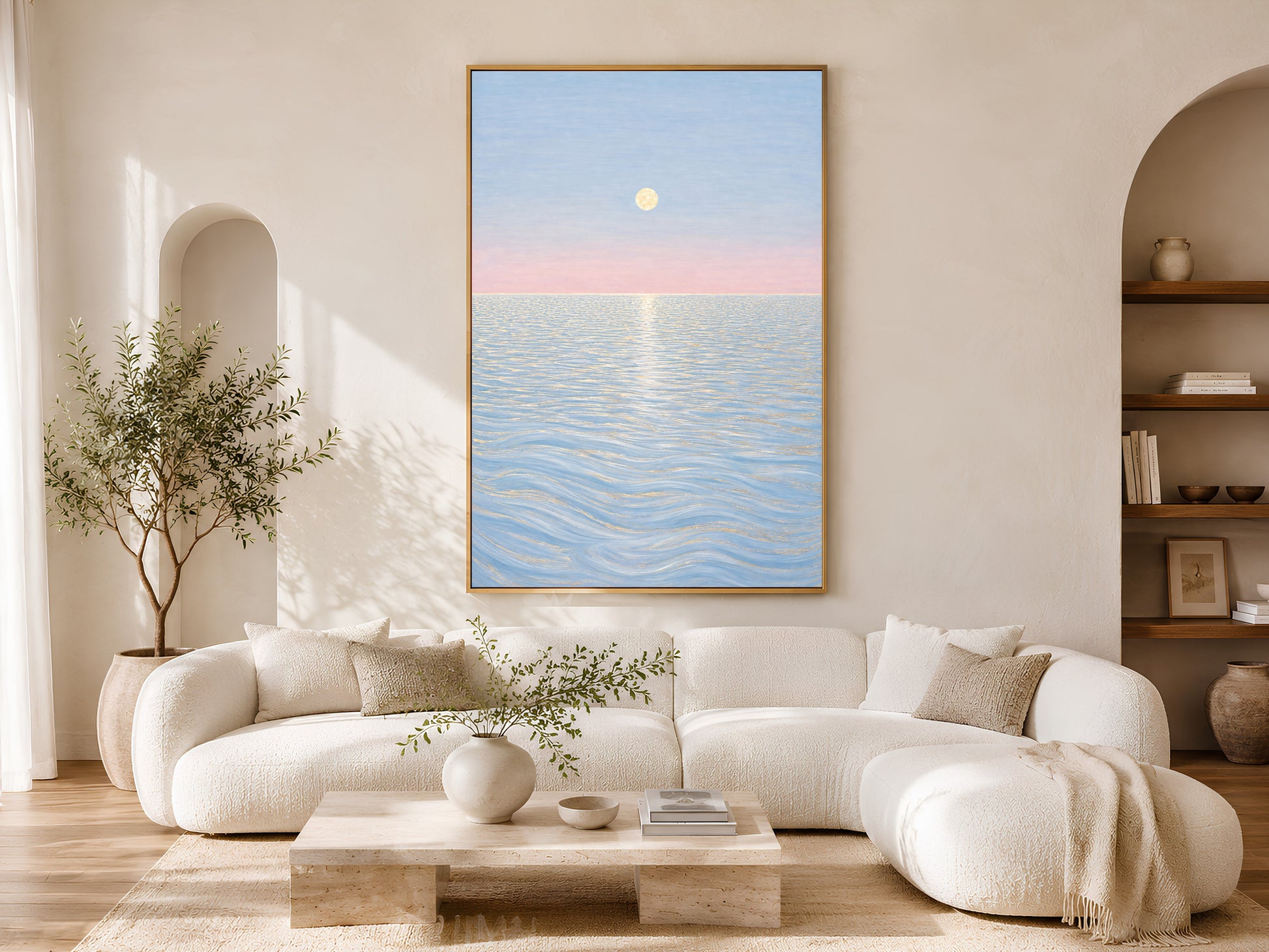 Pastel moon ocean wall art above white sofa in sunlit boho living room
