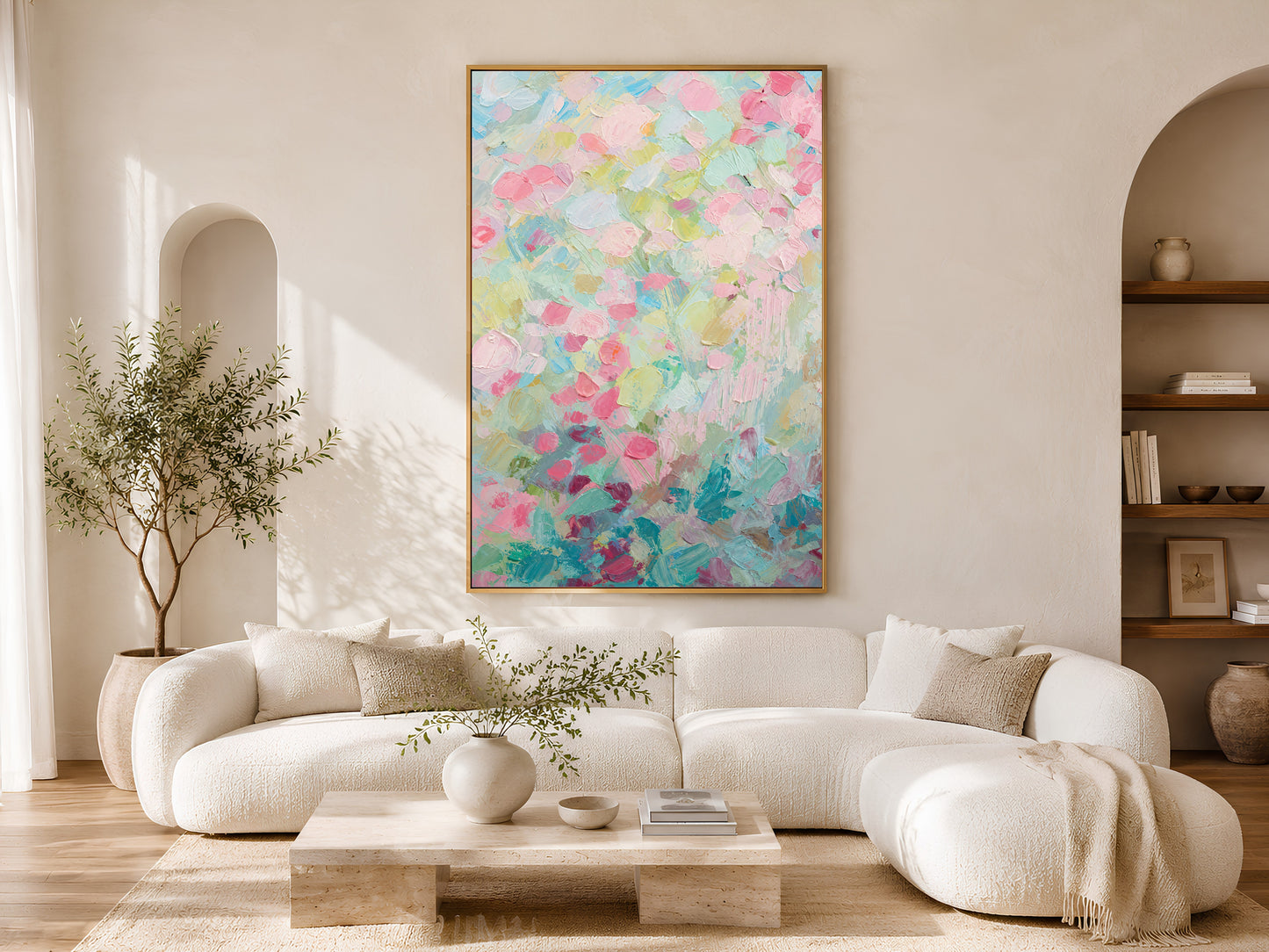 Pastel floral impasto wall art above white sofa in sunlit arched living room
