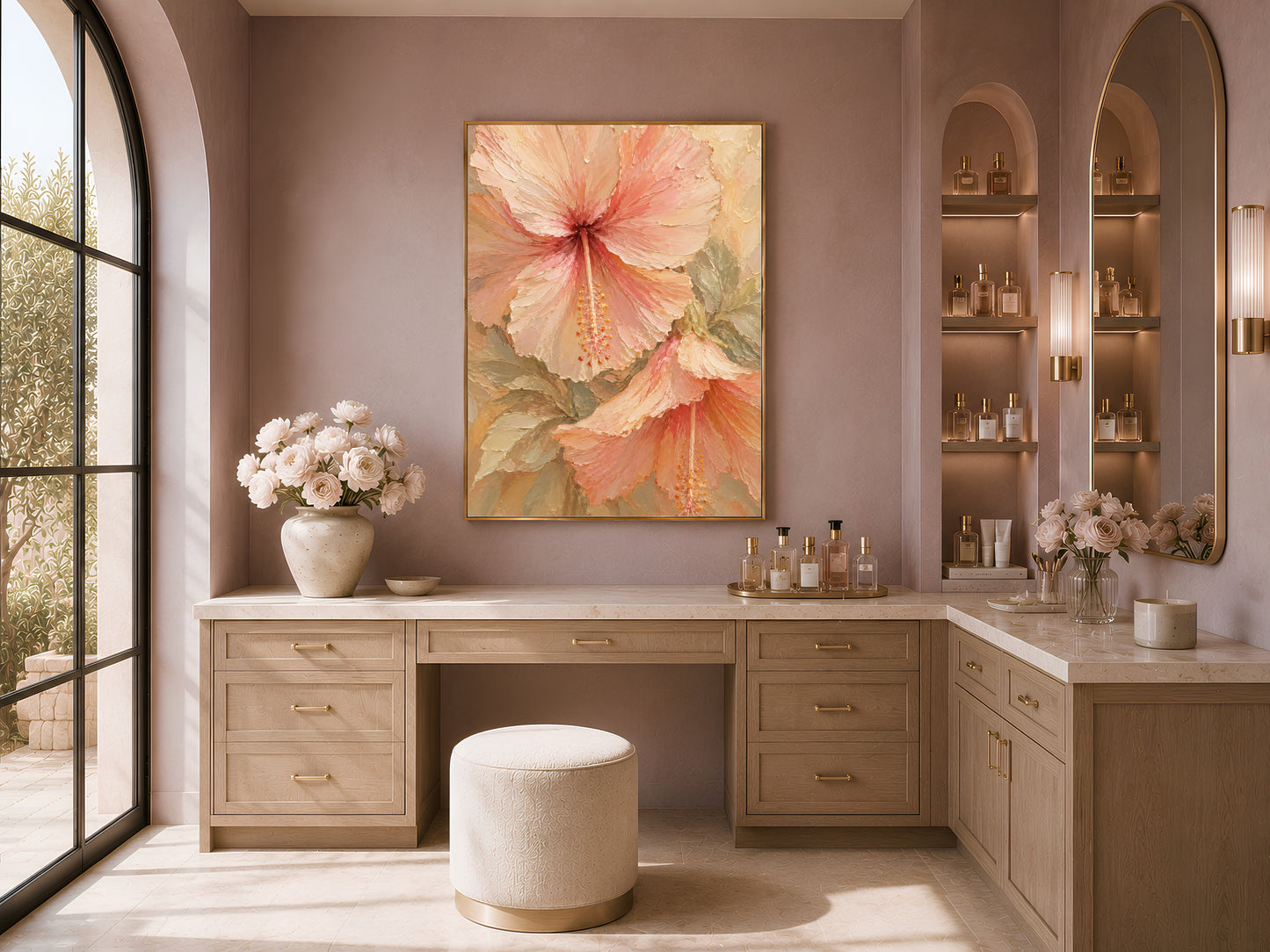 Hibiscus flower print in a gold frame above a vanity in an arched neutral dressing room
