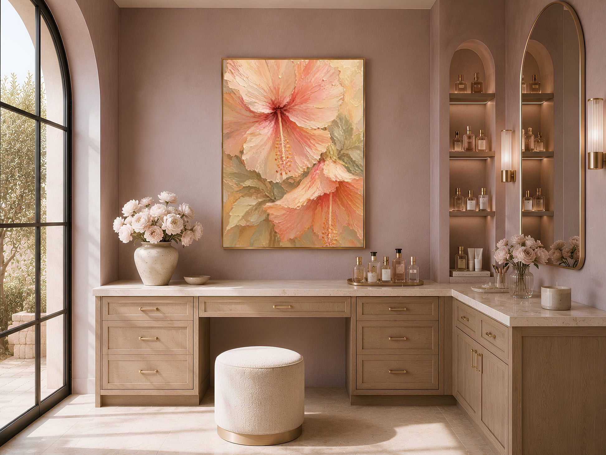 Hibiscus flower print in a gold frame above a vanity in an arched neutral dressing room
