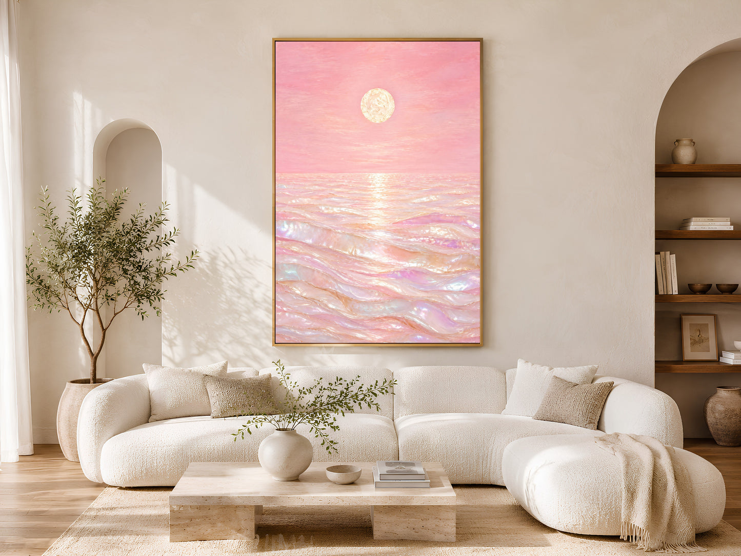 Pink capiz shell ocean wall art above white sofa in sunlit arched living room
