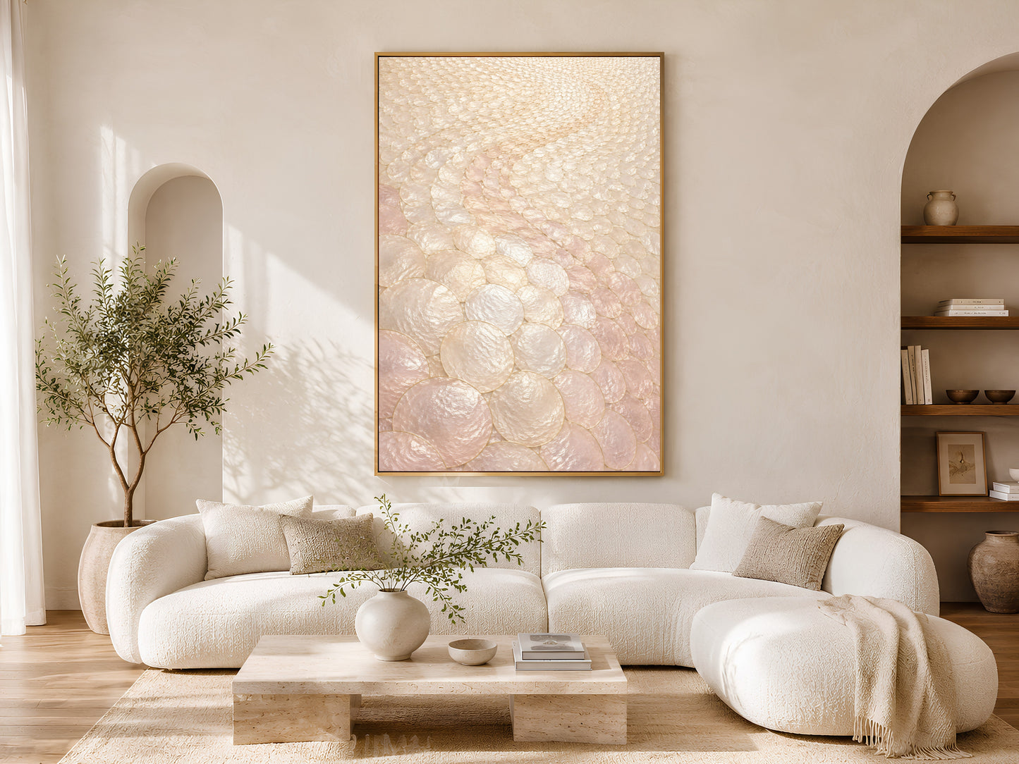 Blush capiz shell wall art above white sofa in sunlit arched living room
