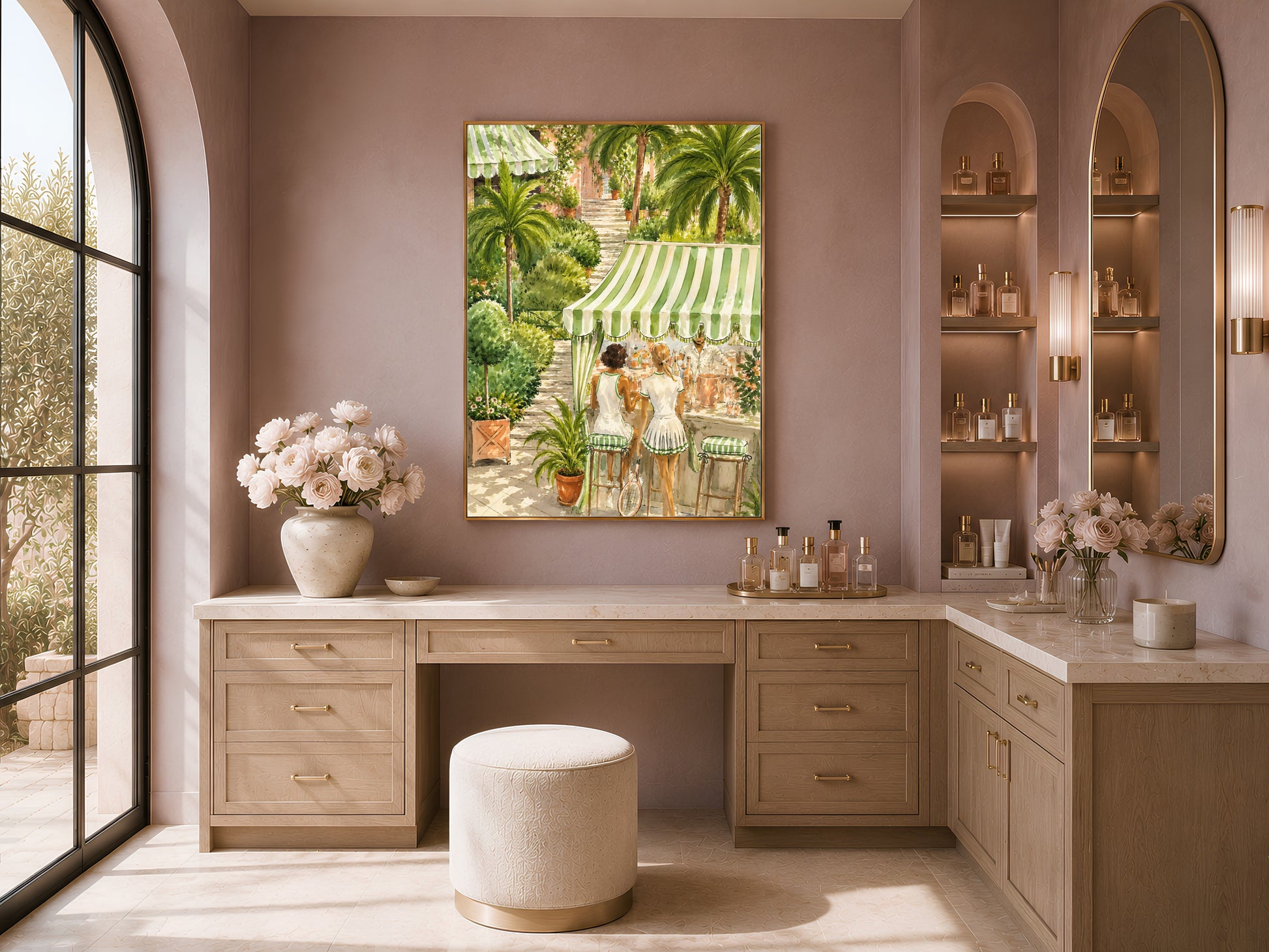 Framed tennis club watercolor print above a wood vanity nook with flowers and a mauve accent wall.
